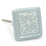 kommodenknopf-quadrat-blume-grau